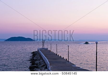 Pier and turtle island in a background, near the city of Neos Marmaros, Sithonia