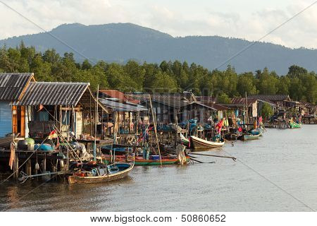 Traditional Thai fishing village along the river and the mangrove in Si Thammarat, Thailand