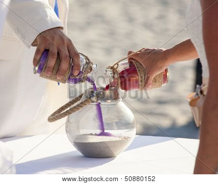 sand ceremony being performed at wedding
