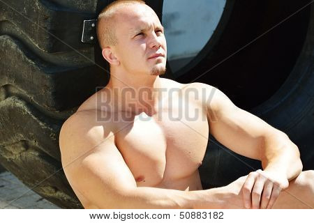 Athletic strong bodybuilder, execute exercise training in sport gym hall