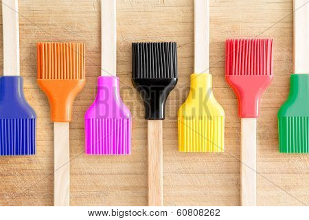Row Of Kitchen Brushes With Colorful Bristles