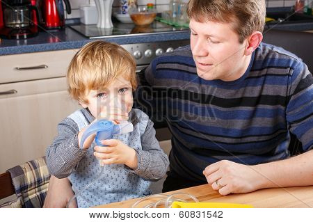Little Boy And His Father Making Inhalation With Nebuliser