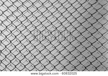 Obsolete Gray Grunge Concrete Closed With Chain Link Fence And Shadows