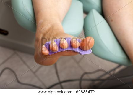 Woman Foot With A Toe Divider