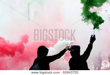 Ultras Fans With Smoke Red White And Green Dressed In Black