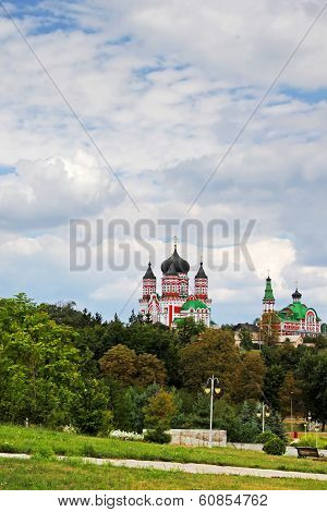 Majestic Church Towers Above The Large Green Garde