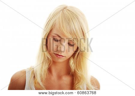 Teen girl looking below, isoalated on white background 