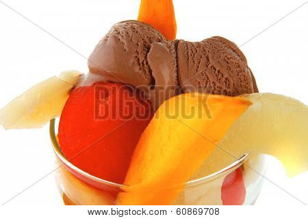 fresh raw  tropical fruits with chocolate ice cream in big glass isolated on white background
