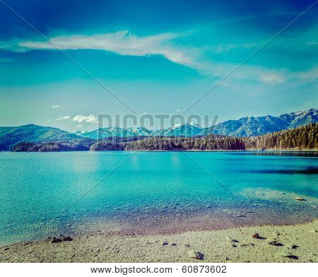 Vintage retro hipster style travel image of Eibsee lake. Bavaria, Germany
