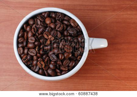 Large White Cup Full Of Coffee Bean