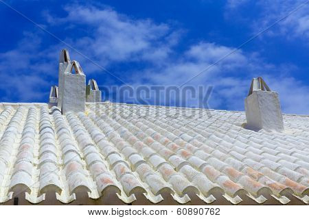 Binibequer Vell in Menorca White roof chimney Sant Lluis at Balearic Islands