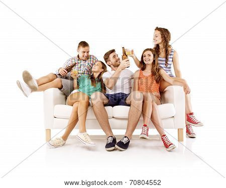 Group of young people with drinks on sofa