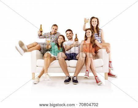 Group of young people with drinks on sofa