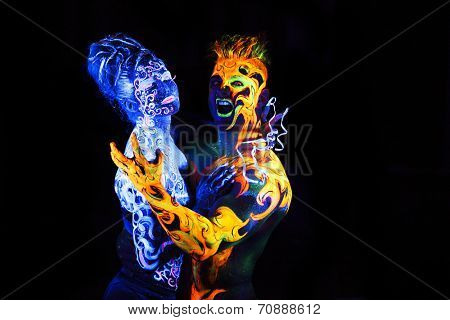 Body art glowing in ultraviolet light,  four elements, Air against Fire