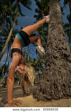 Young woman exercise yoga supported headstand
