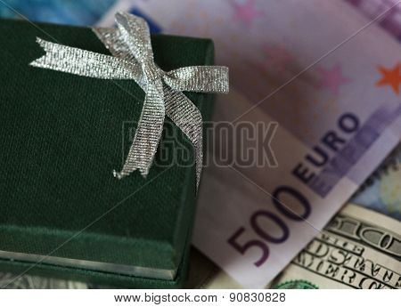 present box and money - dollar and euro