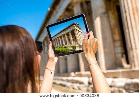 Woman photographing Hephaistos temple in Agora
