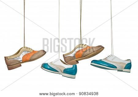 Beautiful Color Woman Shoes Hanging On Laces With Isolated White