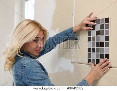 Young woman choose tiles
