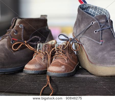 Shoes tied together mom and dad's son. The symbol of family love