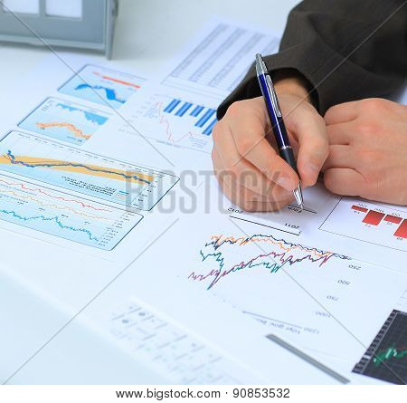 Businessman analyzing investment charts