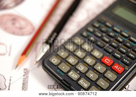 Scientific calculator, Pen and Pencil over the Engineering Drawing Map