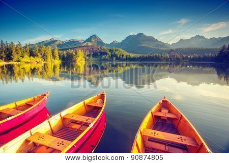Fantastic mountain lake in National Park High Tatra. Strbske pleso, Slovakia, Europe. Dramatic unusual scene. Beauty world. Retro and vintage style, soft filter. Instagram toning effect.