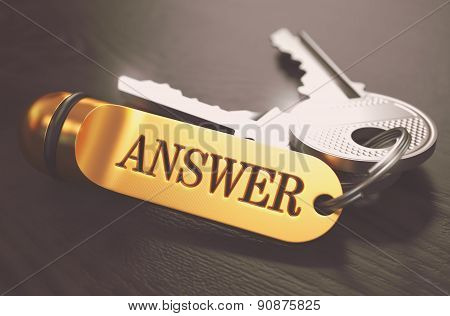 Answer - Bunch of Keys with Text on Golden Keychain.