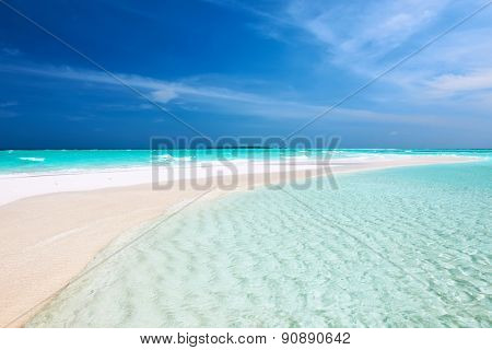 Beautiful island beach with sandspit at Maldives