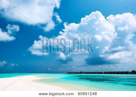 Beautiful island beach with sandspit at Maldives