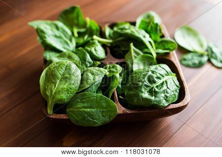 Fresh, Organic Spinach In A Bowl On Rustic Wooden Background.
