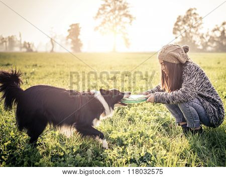 Woman Playing With Dog