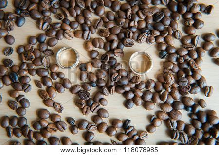 Many Brown Coffee Beans With Wedding Rings