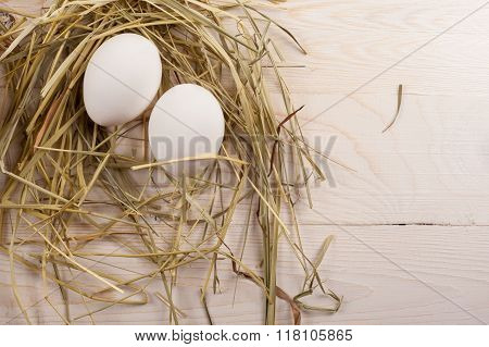 Easter eggs on white wooden background