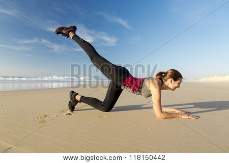 Shoot of a beautiful woman exercising herself in the beach