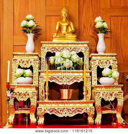 A set of altar table on wood wall.