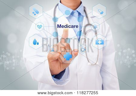 Doctor hand touching medicare sign on virtual screen. medical concept