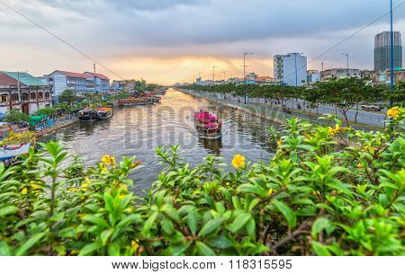 Close up flower boat on river suftwaves rays sunset