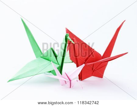 colorful paper origami birds on a white background