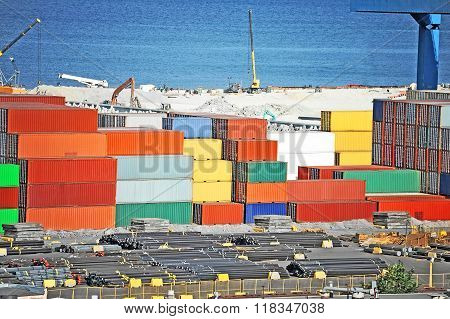 Cargo Container, Pipe And Grain Drayer In Port