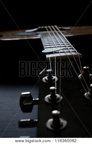 Closeup detail of guitar strings for playing music instrument talent strum strumming