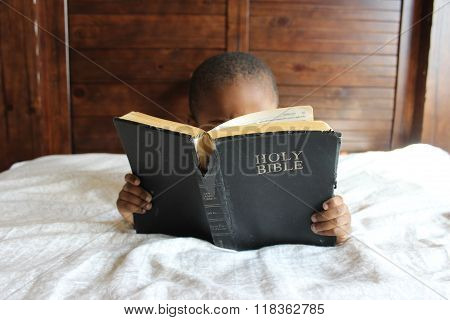 Child Reading Bible