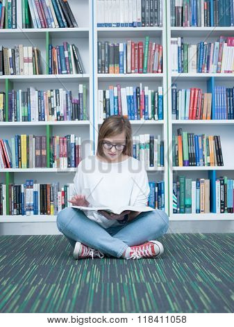 student girl  in collage school library reading book