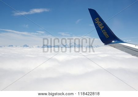 An Aircraft Wing Over Clouds
