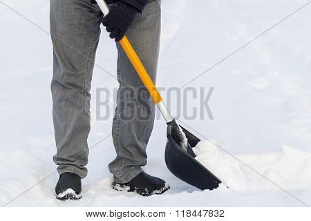Man using snow shovel in winter