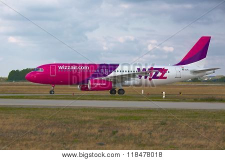 BUDAPEST, HUNGARY - SEPTEMBER 15, 2014: Wizzair A320 taxiing at Budapest Liszt Ferenc Airport, Budapest is one of Wizzair's most important bases.