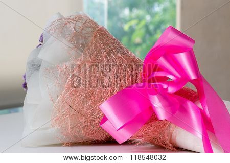 bouquet and ribbon for flower on table
** Note: Shallow depth of field