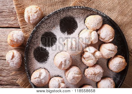 Delicious Carnival Castagnole Close-up On A Plate. Horizontal Top View