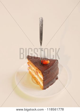Layered chocolate cake with strawberry slice