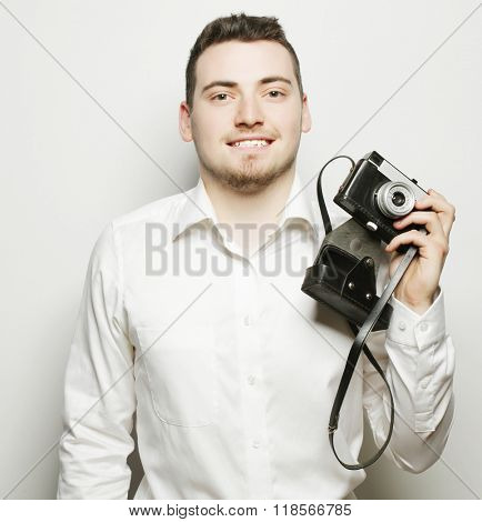 young  photographer over white background